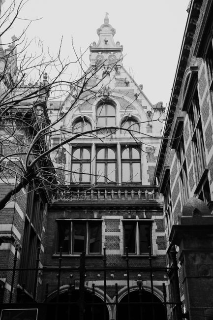 Black and white photo of a historic Gothic building exterior in Hasselt, Belgium.