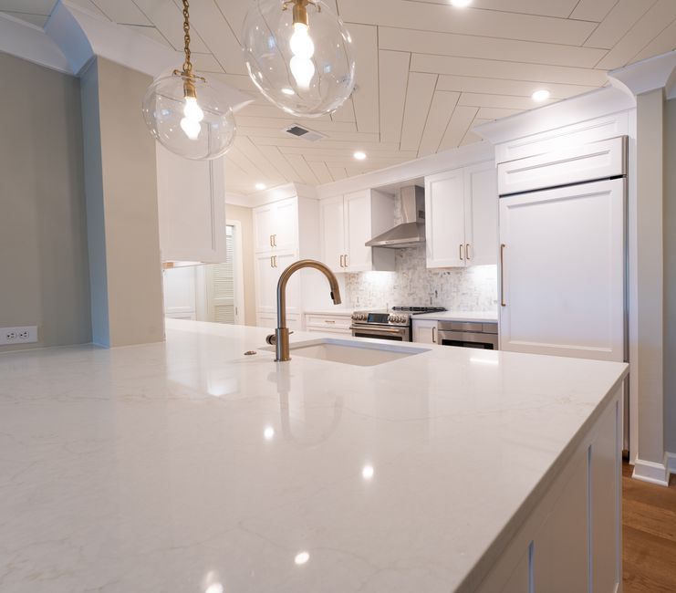 Modern white kitchen with marble island