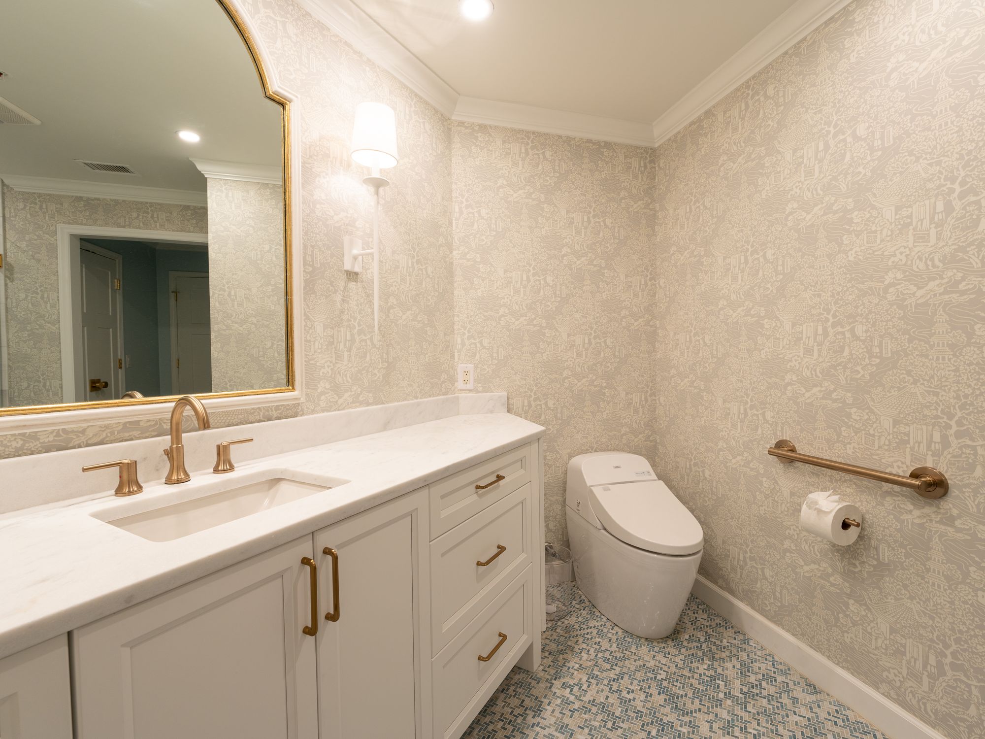 Wallpapering in Hanwell, Ealing — decorator hanging pattern-matched wallpaper