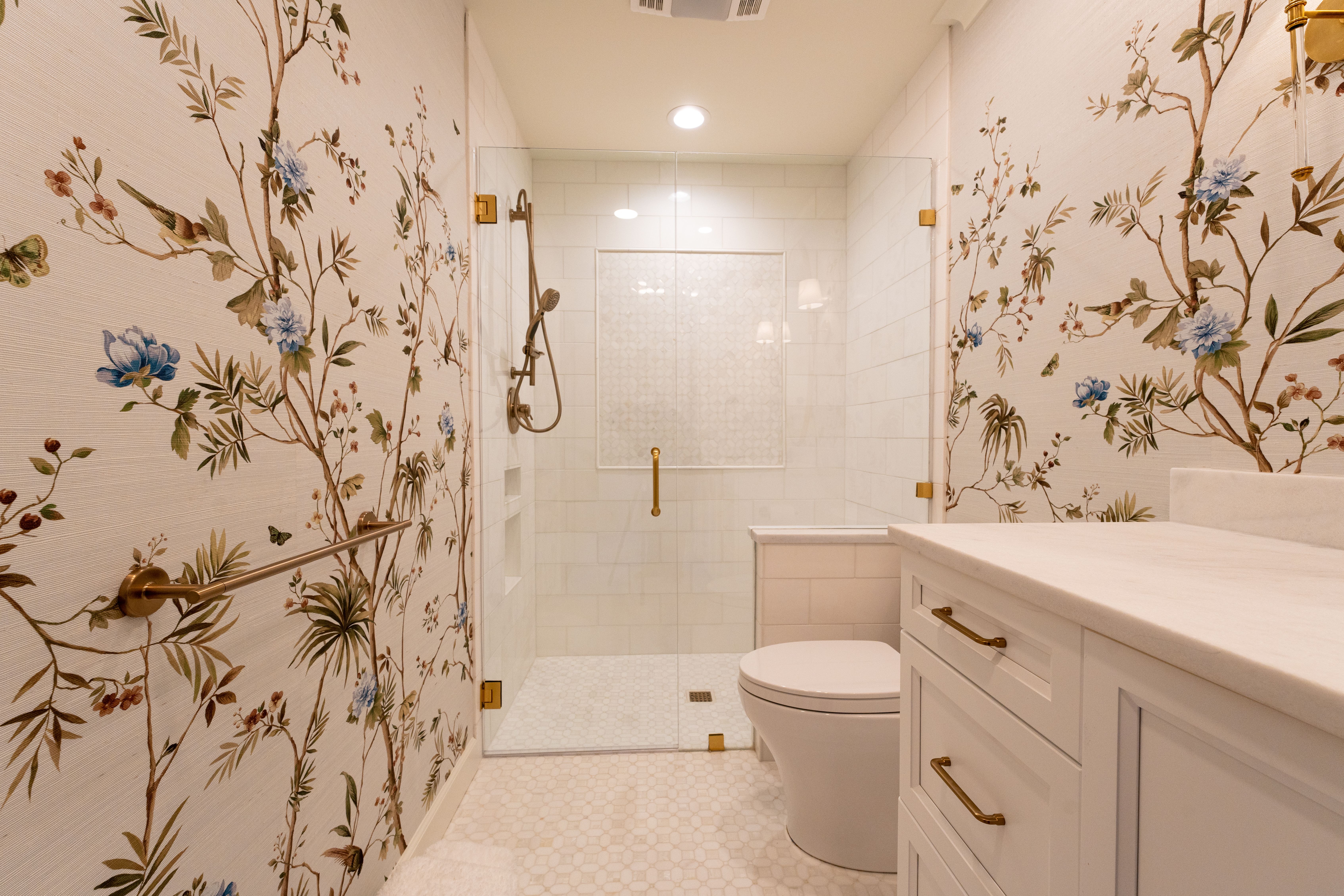 Wallpapering in South Kensington — clean edges cut in around trim and sockets