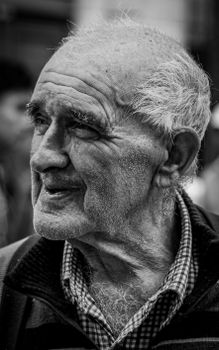 Intimate black and white portrait of an elderly man, capturing wisdom and emotions.