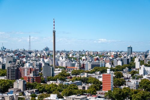 Free A scenic view of Montevideo's cityscape featuring the iconic Telecommunications Tower under a clear blue sky. Stock Photo
