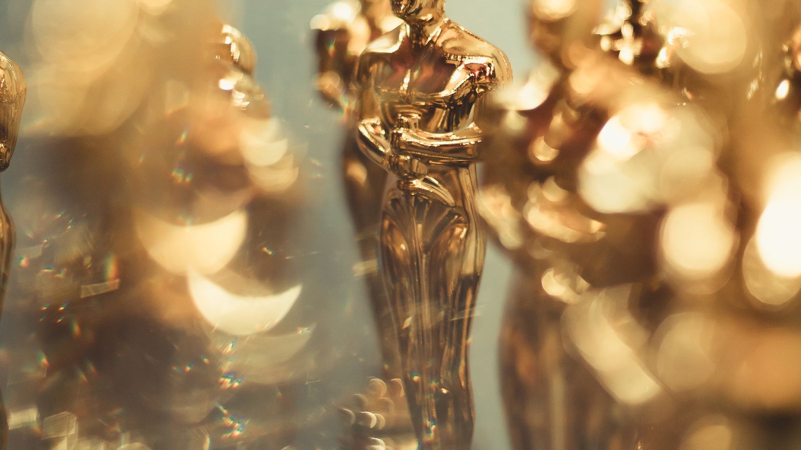 Close-up of several golden trophy statuettes resembling Oscars, a real stock photo with no people in the frame that stands in for the Academy Award the makers of Gods Don't Give Gifts say they are chasing