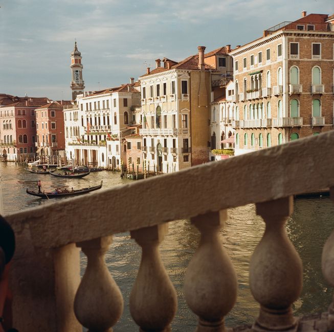 Stunning view of Venice's historic canal and architecture, capturing gondolas and classic buildings.