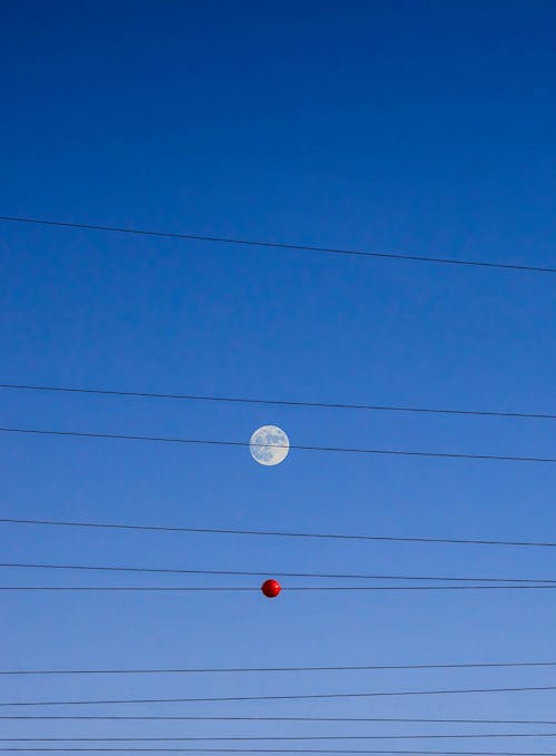 Free Black Power Line and Red Round Under Blue Sky Stock Photo