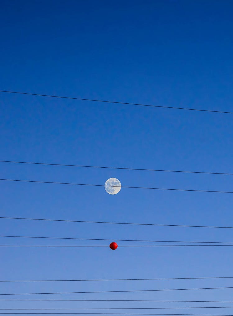 Black Power Line And Red Round Under Blue Sky