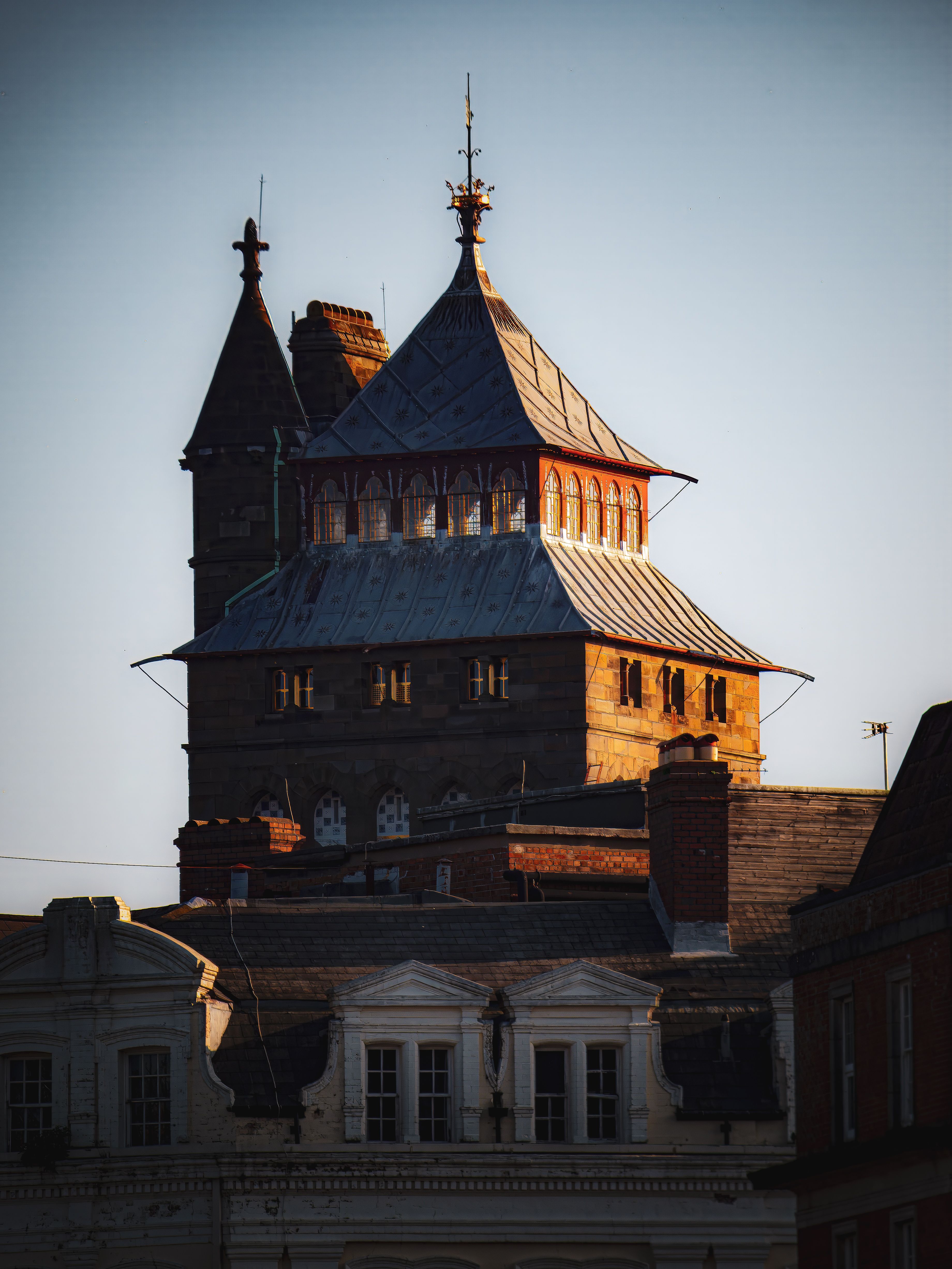 Historic Building with Steeped Roof at Sunset · Free Stock Photo
