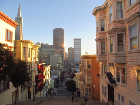 A scenic street view of San Francisco's architecture during sunset, capturing iconic skyscrapers.