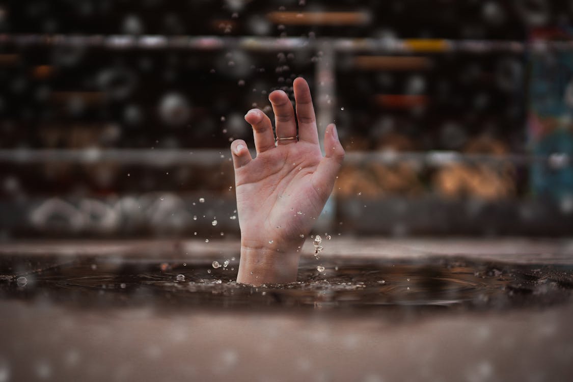 Free Person Drowning in Water Stock Photo