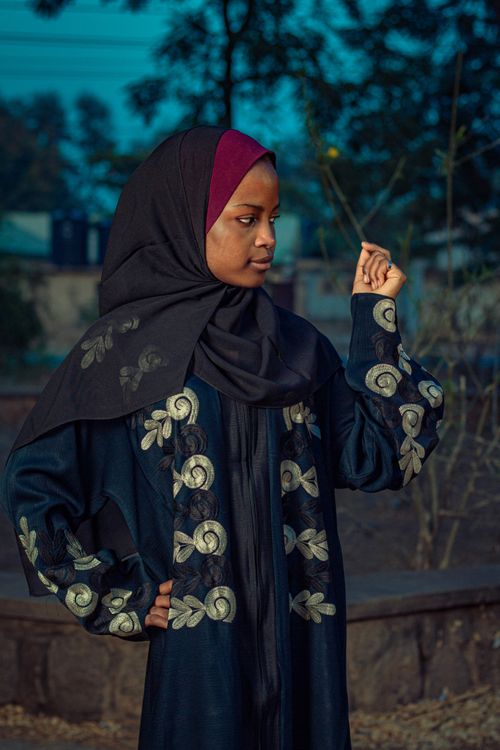 Free A woman in traditional attire with intricate patterns, outdoors in Zaria City, Nigeria. Stock Photo
