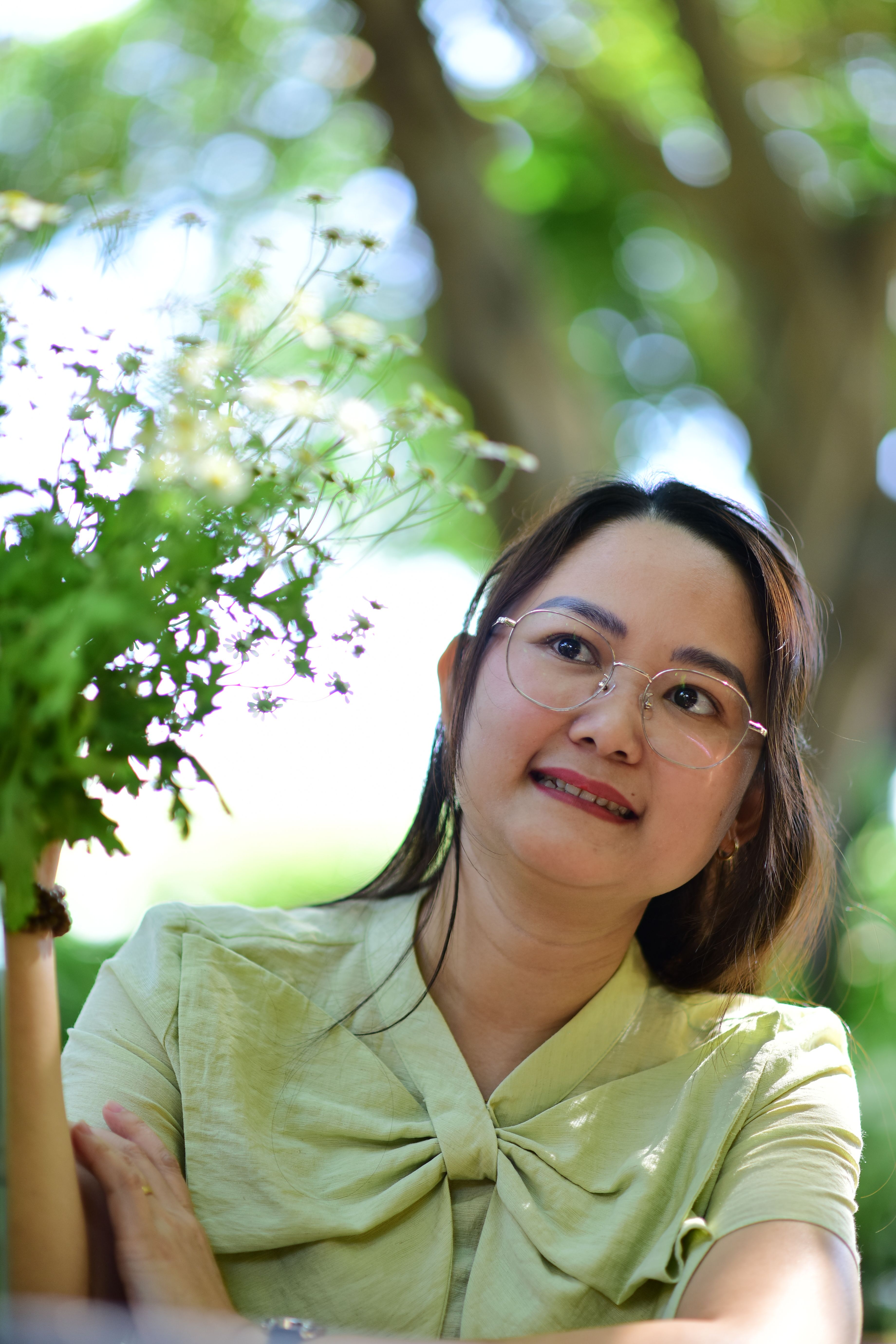 Portrait of a Smiling Woman Outdoors in Nature · Free Stock Photo