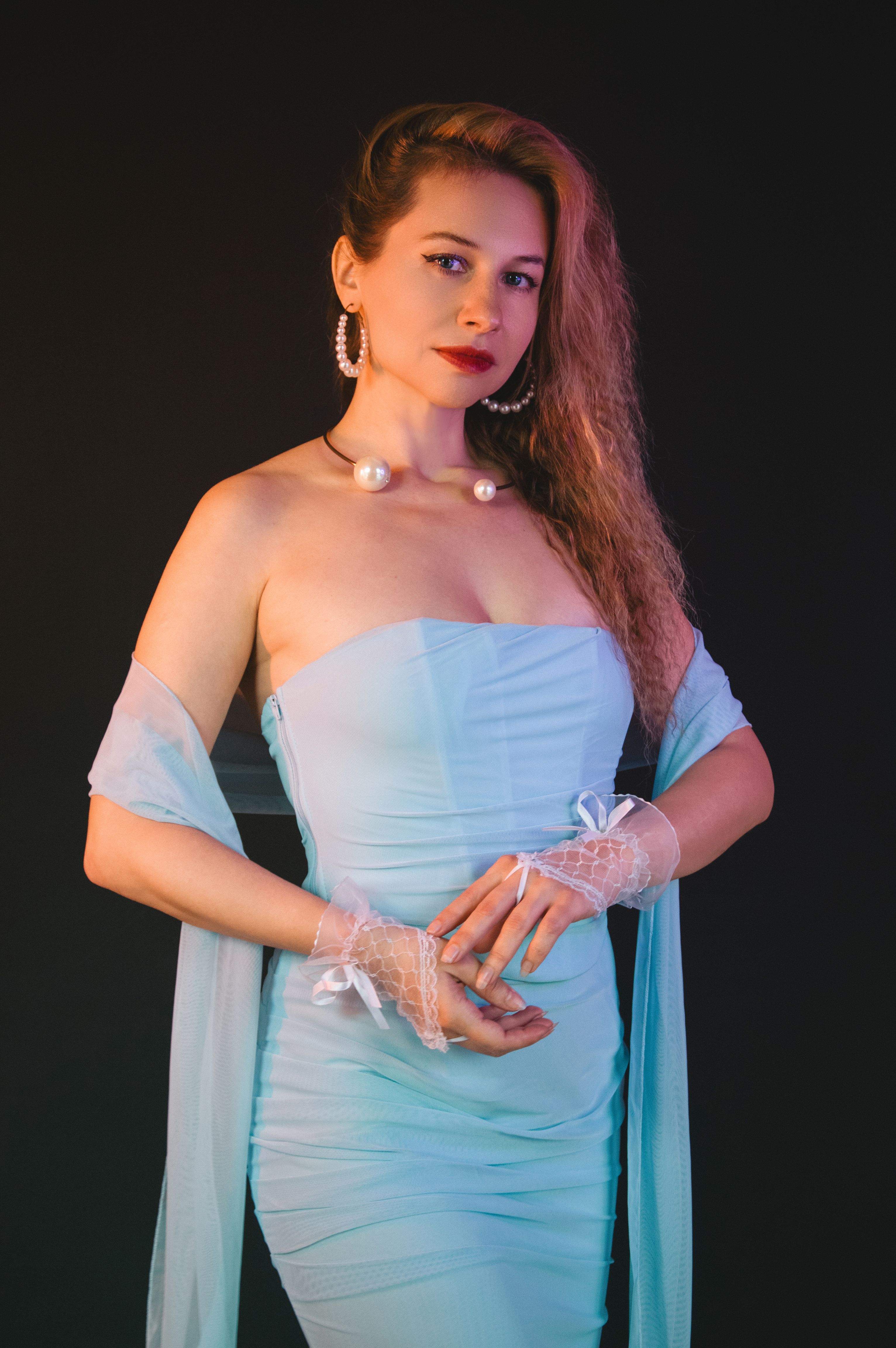 Elegant Woman in Blue Evening Dress Posing · Free Stock Photo