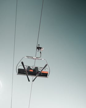 Empty ski lift chair in a clear sky, perfect for winter sports and outdoor adventure
