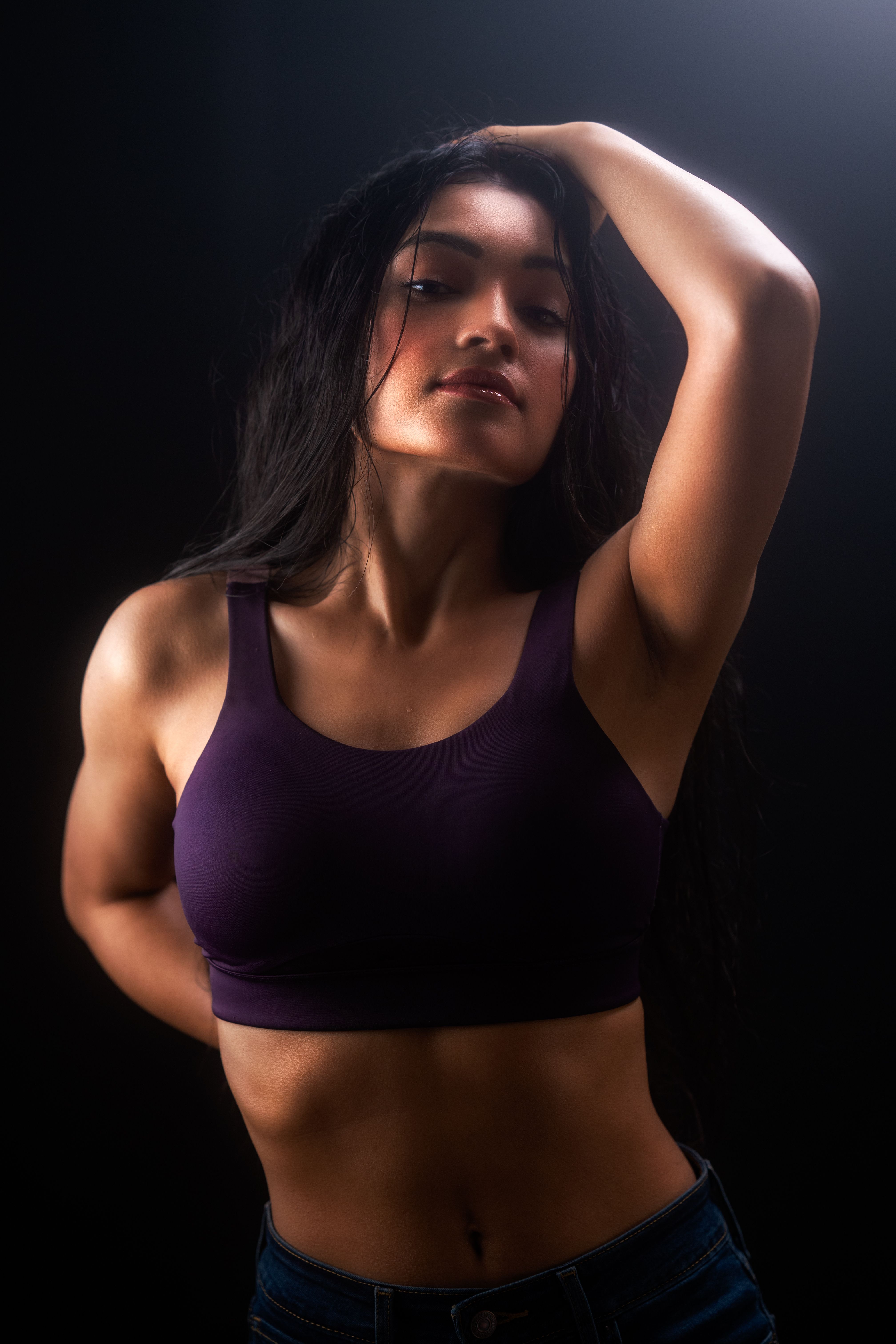 Fitness coach standing in a studio with natural light