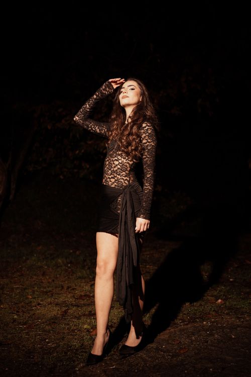 Elegant Woman in Lace Dress at Night Outdoors · Free Stock Photo