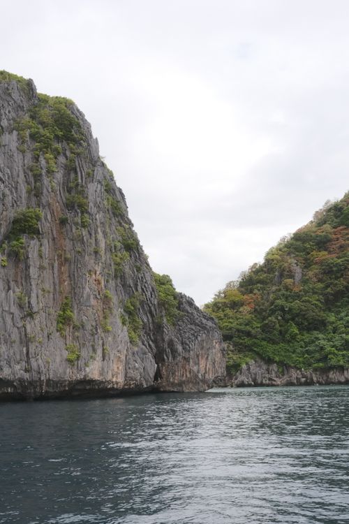 Free Stunning limestone cliffs rise above the ocean in Mimaropa, showcasing natural beauty. Stock Photo