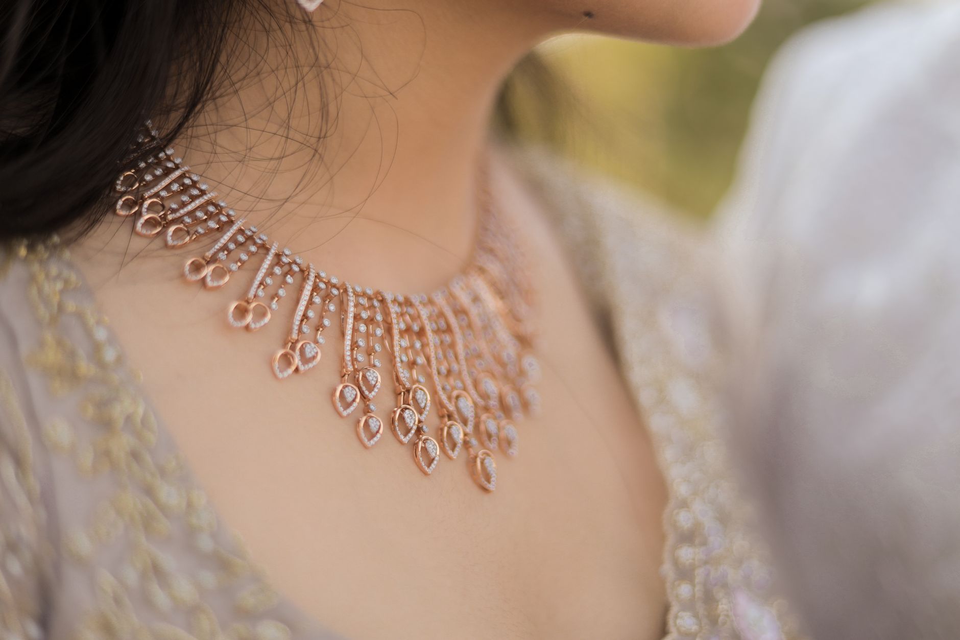 Close-up image showcasing an exquisite bridal necklace with intricate details and traditional attire.