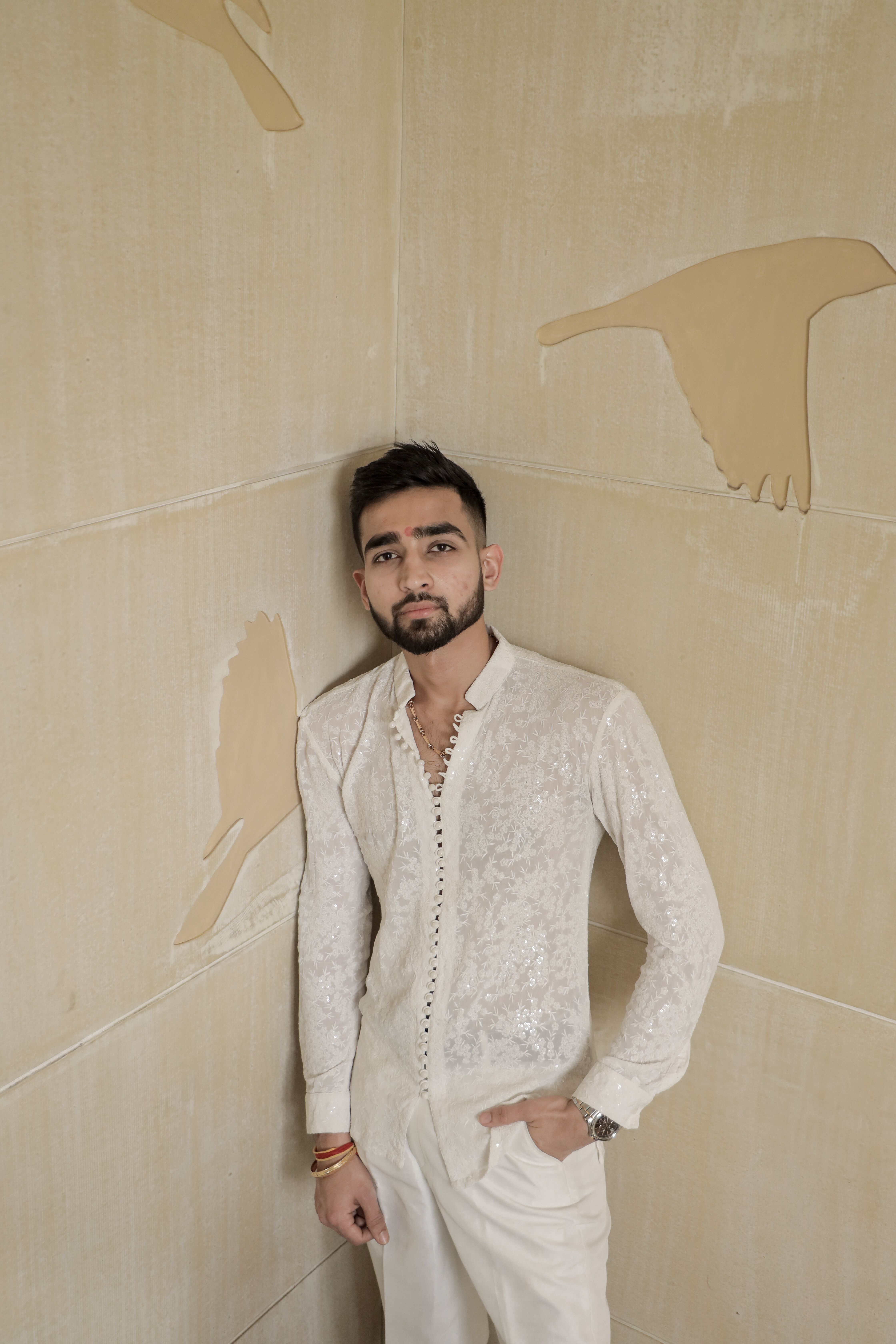 Portrait of a groom in traditional South Asian attire, exuding elegance and style.