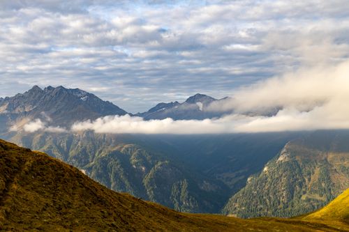 Free Breathtaking view of the Korutany mountains with rugged peaks and clouds in Austria. Stock Photo