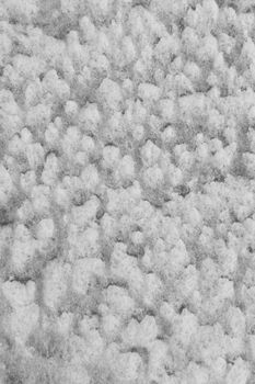 Detailed view of snow texture in Konaev, Kazakhstan, showcasing intricate patterns.