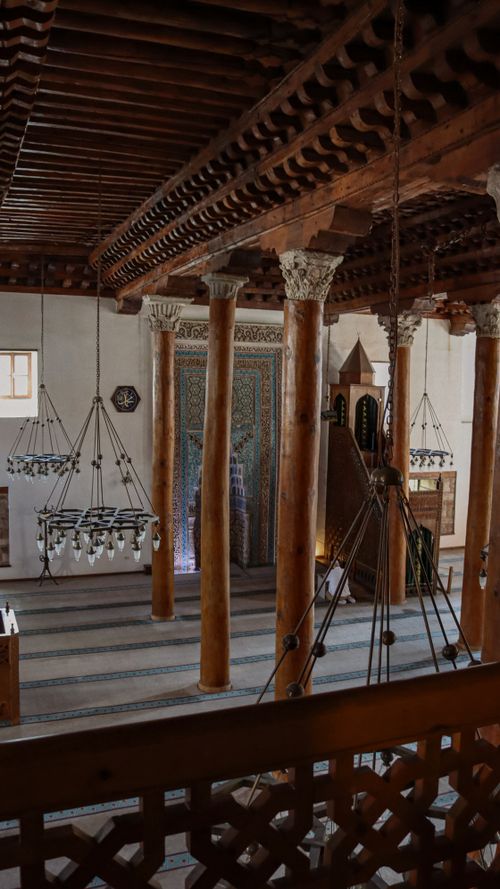 Free Explore the historic beauty of an ancient mosque in Ankara, Türkiye with intricate wooden architecture. Stock Photo