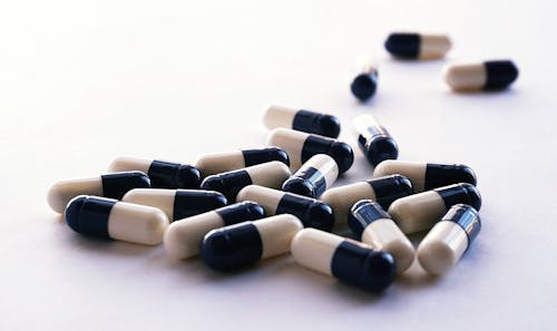 Free White And Black Medicine Capsules Stock Photo