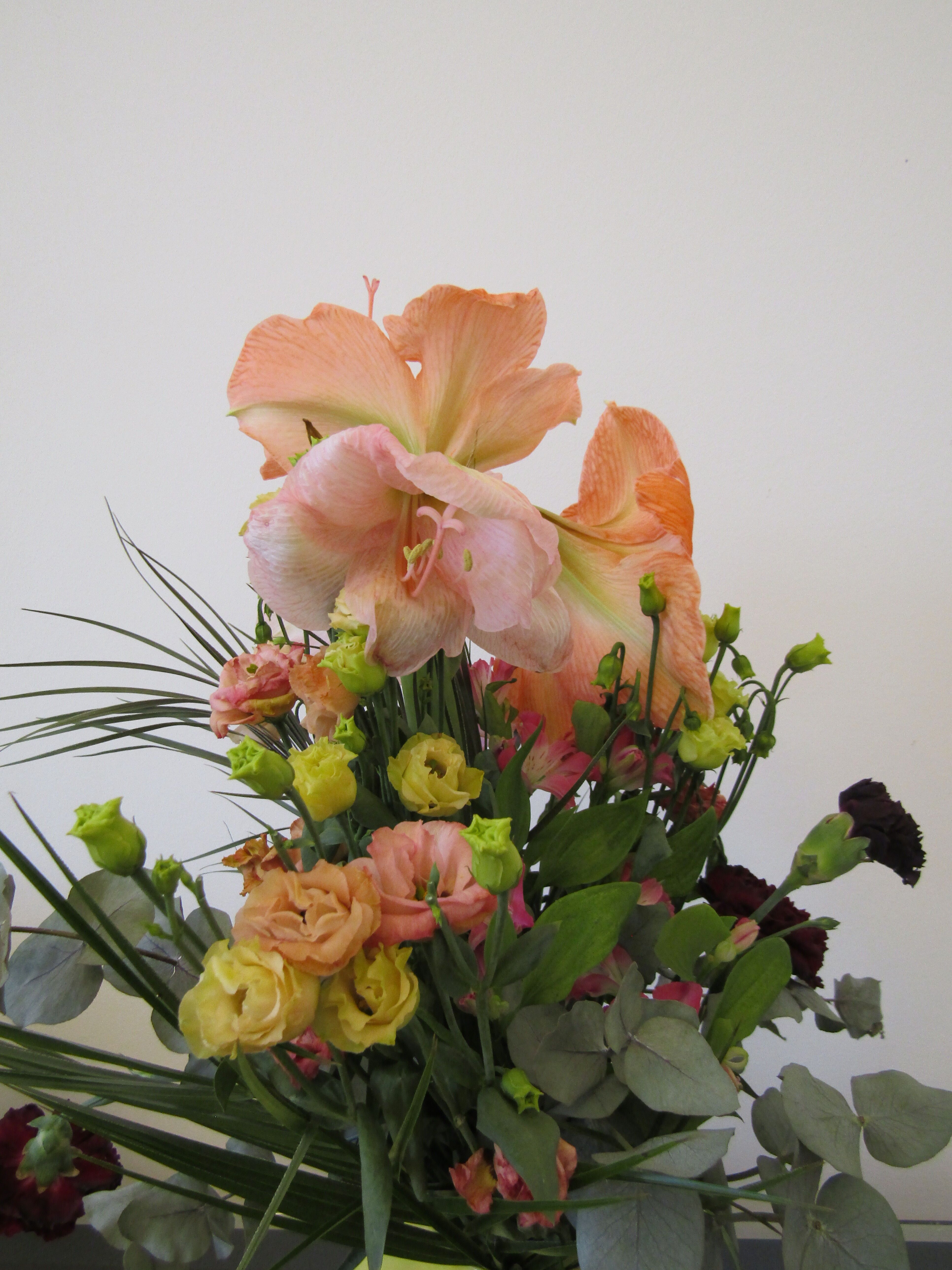 Colorful assortment of flowers including lilies and roses in a decorative bouquet captured in Berlin.