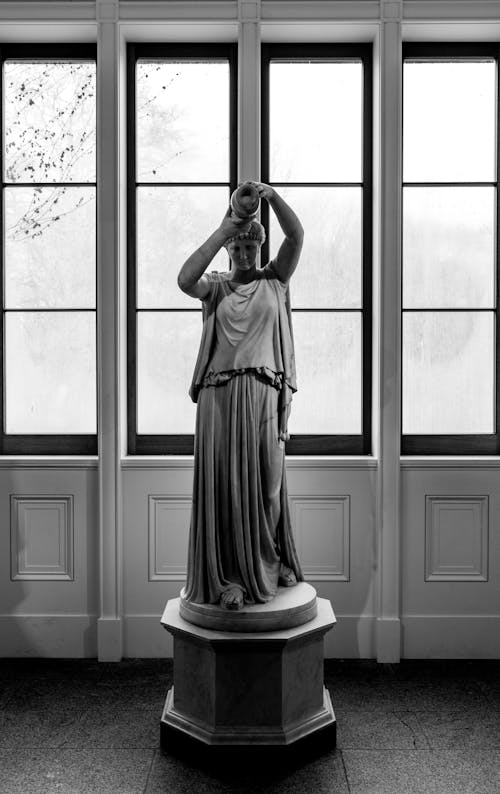 Grayscale Photo Of A Statue