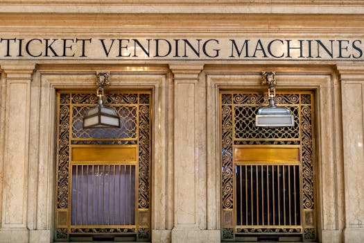 Classic architectural entrance of ticket vending machines in a New York building.