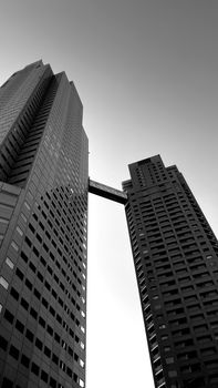 Monochrome view of modern skyscrapers in Tokyo's urban skyline, Japan.