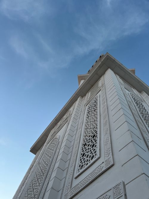 Free Beautifully detailed architectural facade against a clear blue sky in Laghouat, Algeria. Stock Photo