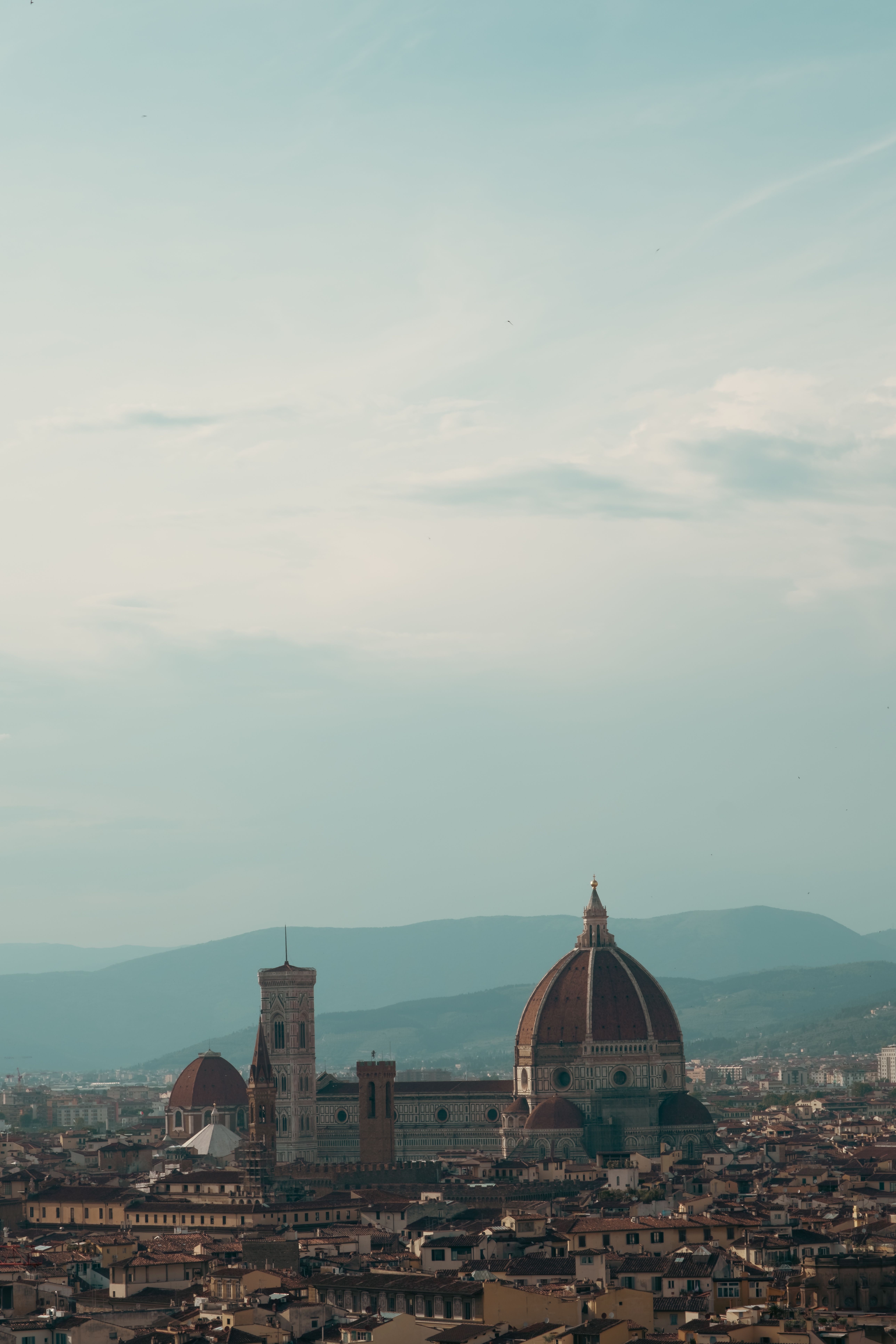 A beautiful aerial view of Florence's iconic Duomo and historic skyline during the day.
