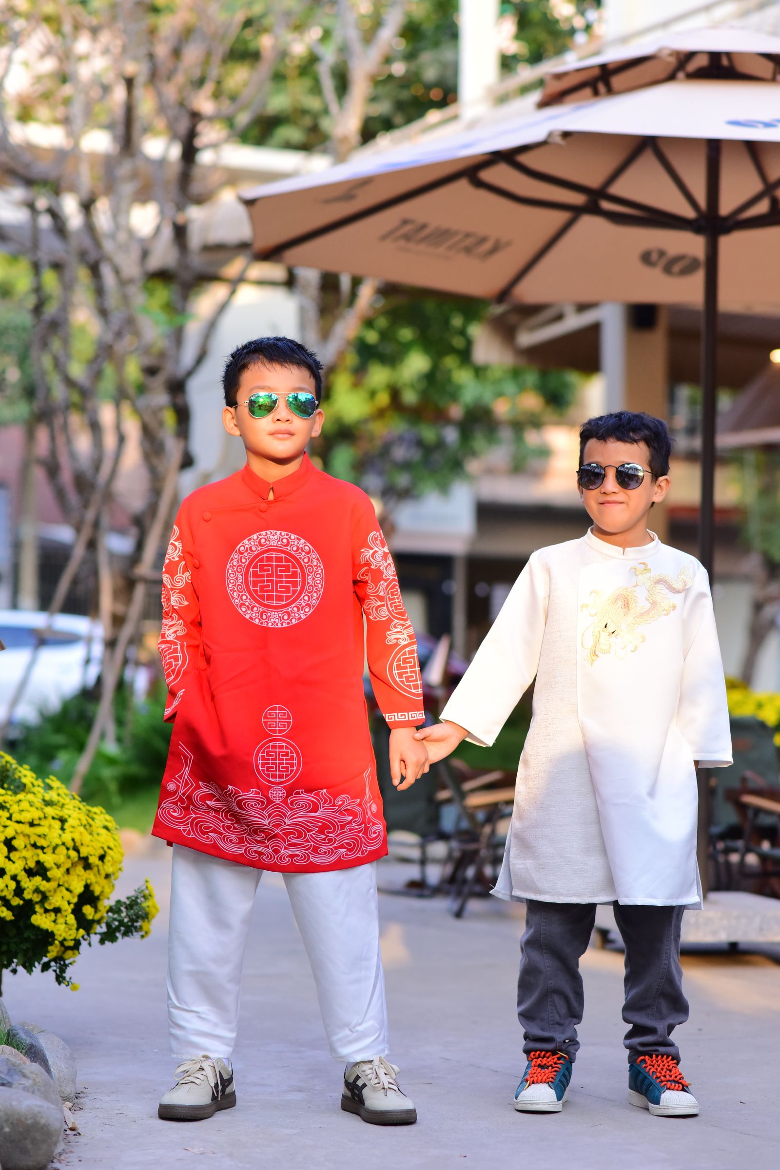 Two Boys in Traditional Clothing Holding Hands · Free Stock Photo