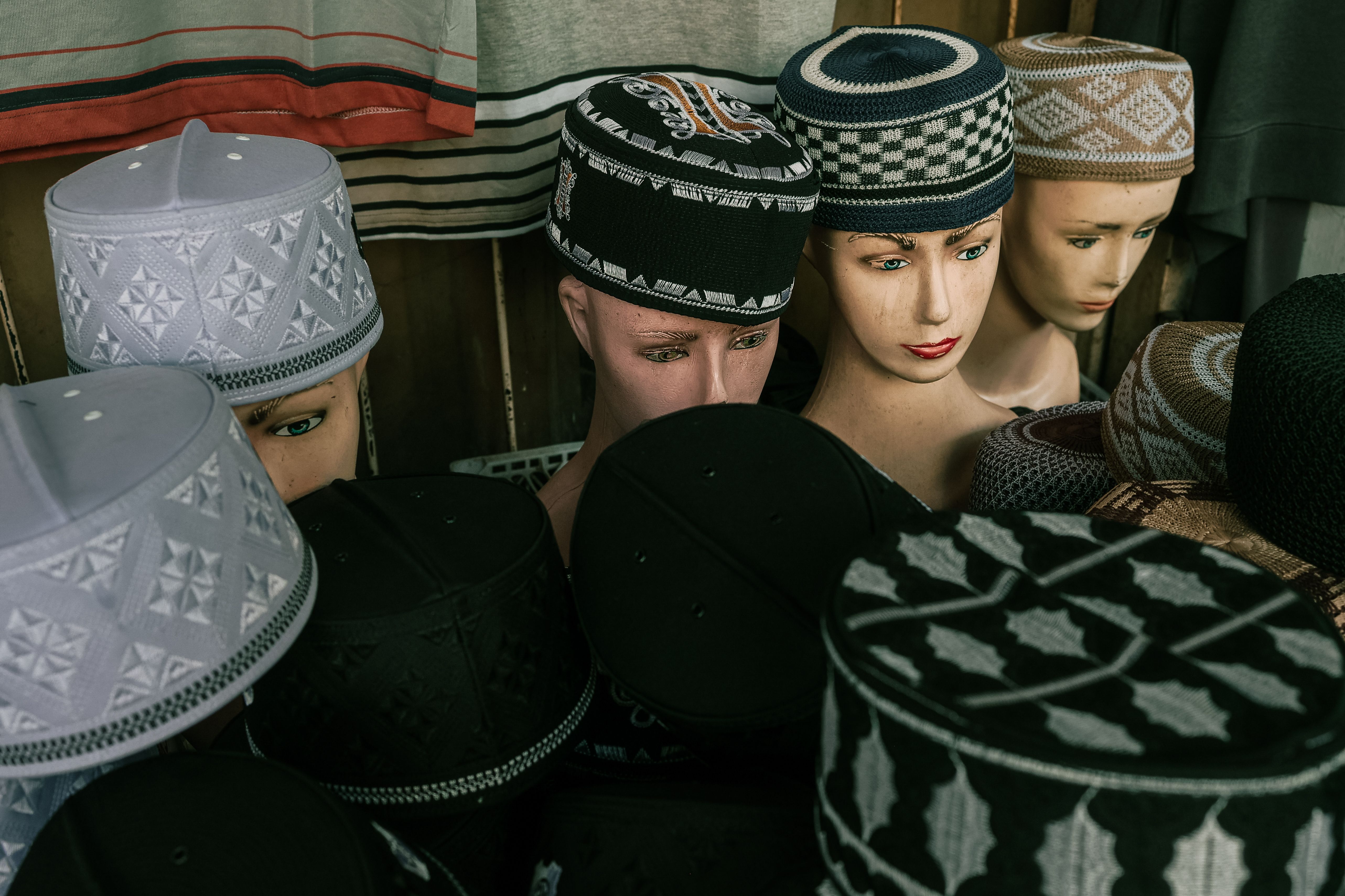 Traditional Islamic kufi cap in white and cream tones