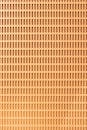 背景为抽象的橙色图案，带有无缝矩形孔，适用于设计