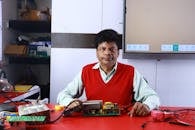 Man Teaching Electronics Repair in Classroom