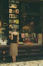 Woman Browsing Bookstore Window Display