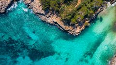 Turquoise water and sandy cove in the Balearic Islands