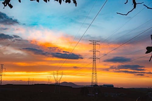 Silhouette of Electric Towers during Sunset