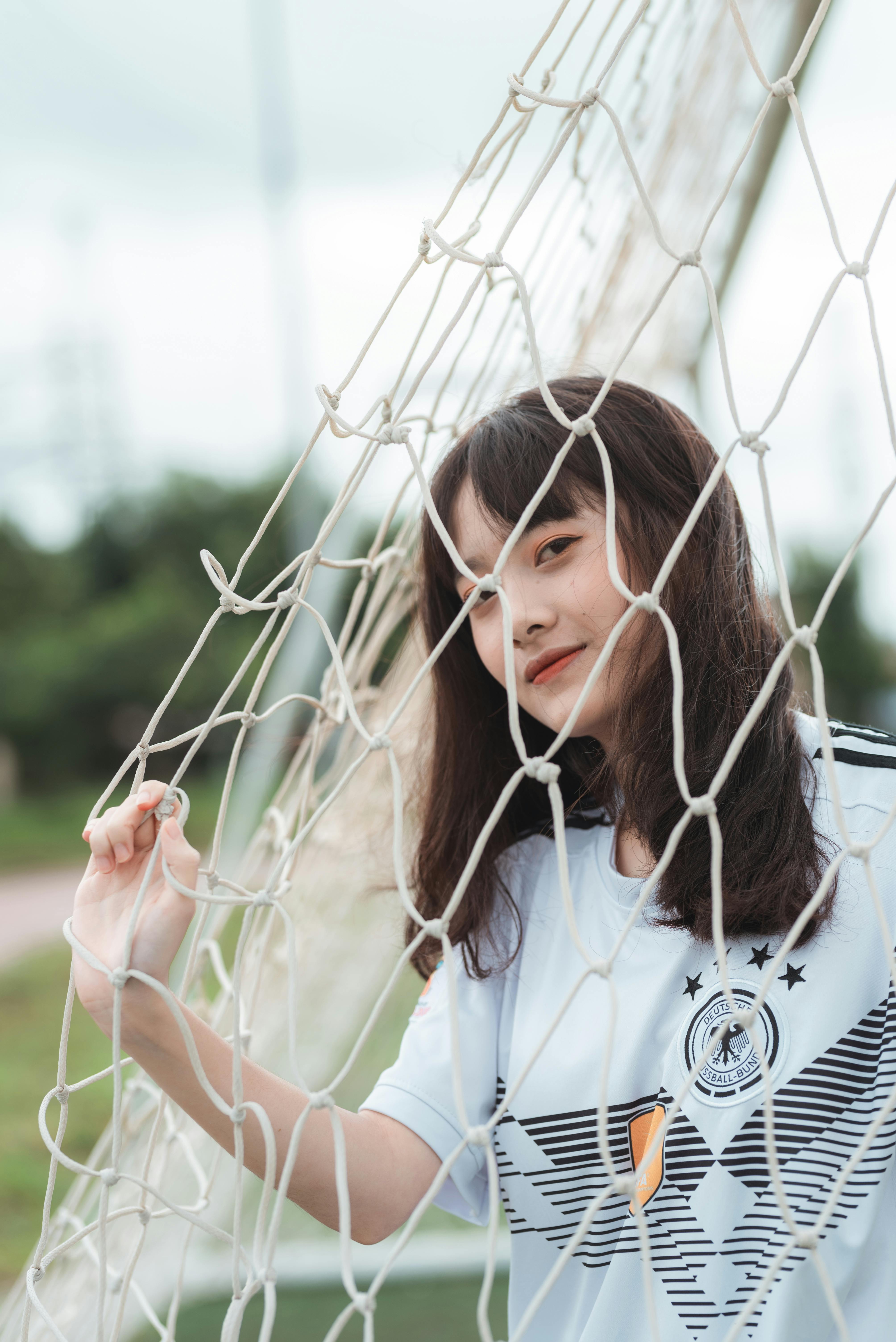 woman standing by the soccer net