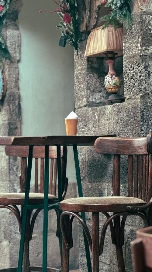 Free Charming café scene with vintage furniture in Damascus, Syria, offering a warm and inviting atmosphere. Stock Photo