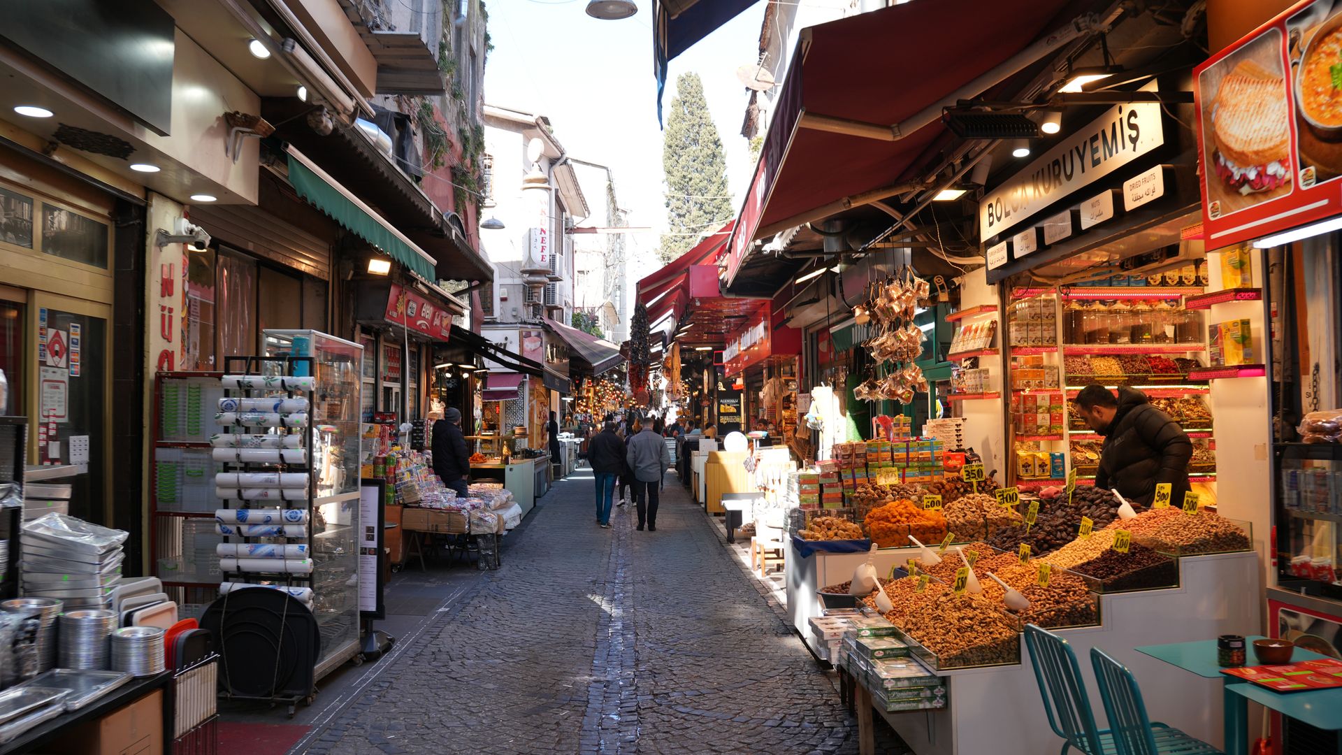 Vibrant street market scene with shops and people in Istanbul, showcasing Turkish culture — best modafinil vendor 2026