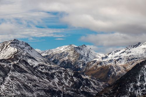 Free Breathtaking view of snow-covered mountains against a dramatic sky in Korutany, Rakousko. Stock Photo