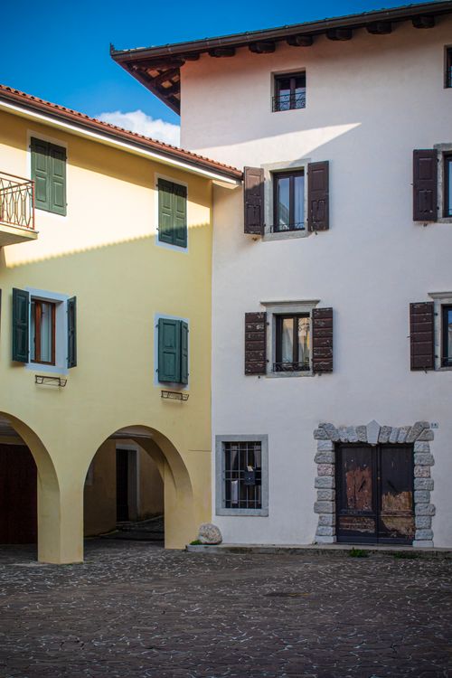 Free Explore the rustic charm of historic Italian architecture in San Daniele del Friuli's peaceful alley. Stock Photo