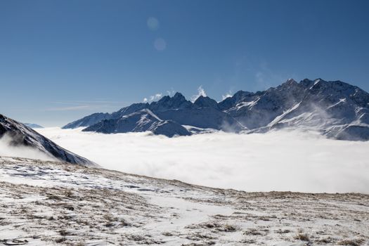 Breathtaking winter landscape of the Heiligenblut mountains in Austria with fresh snow and blue skies.