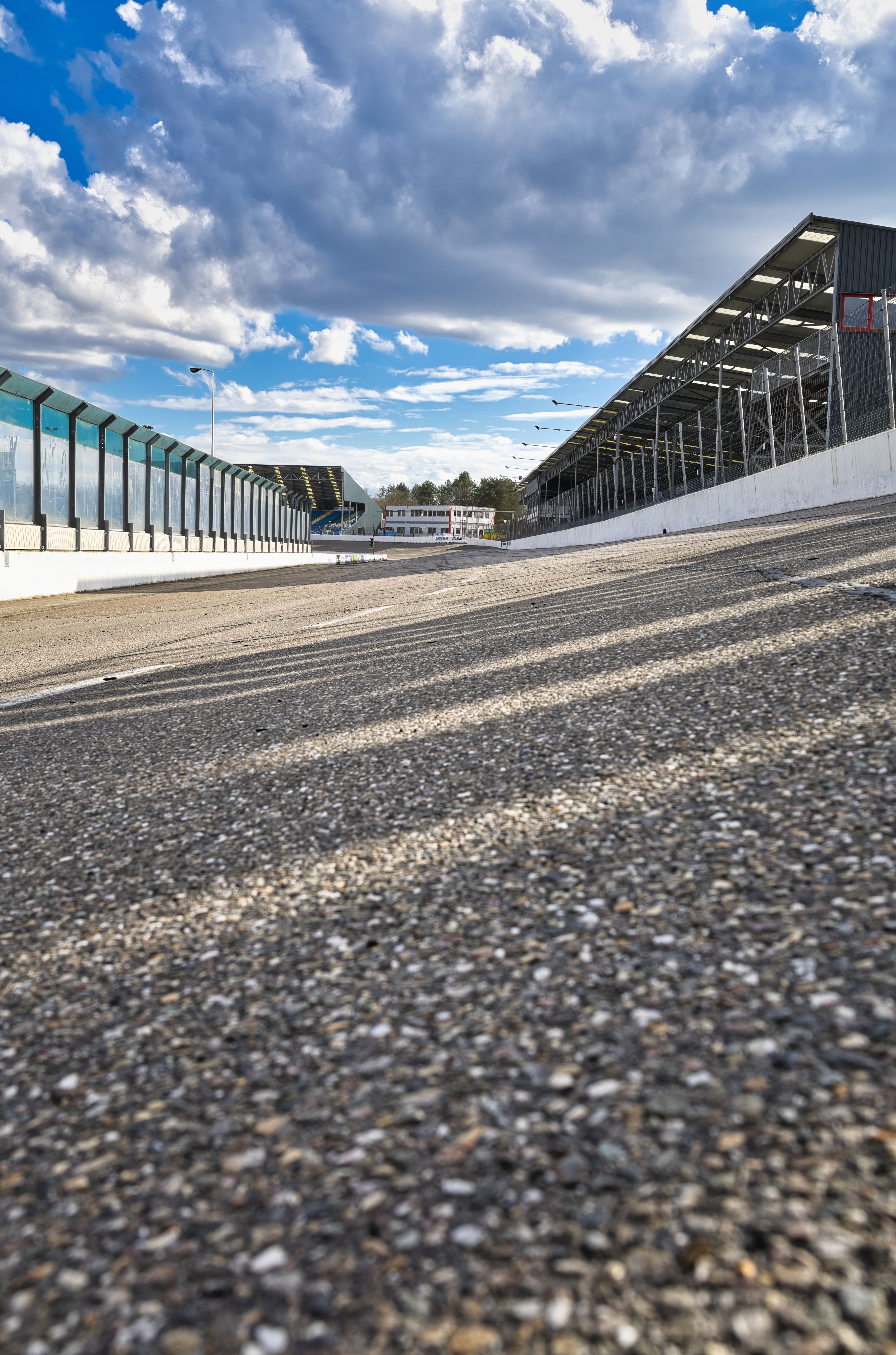 Empty Race Track with Grandstand on a Sunny Day · Free Stock Photo