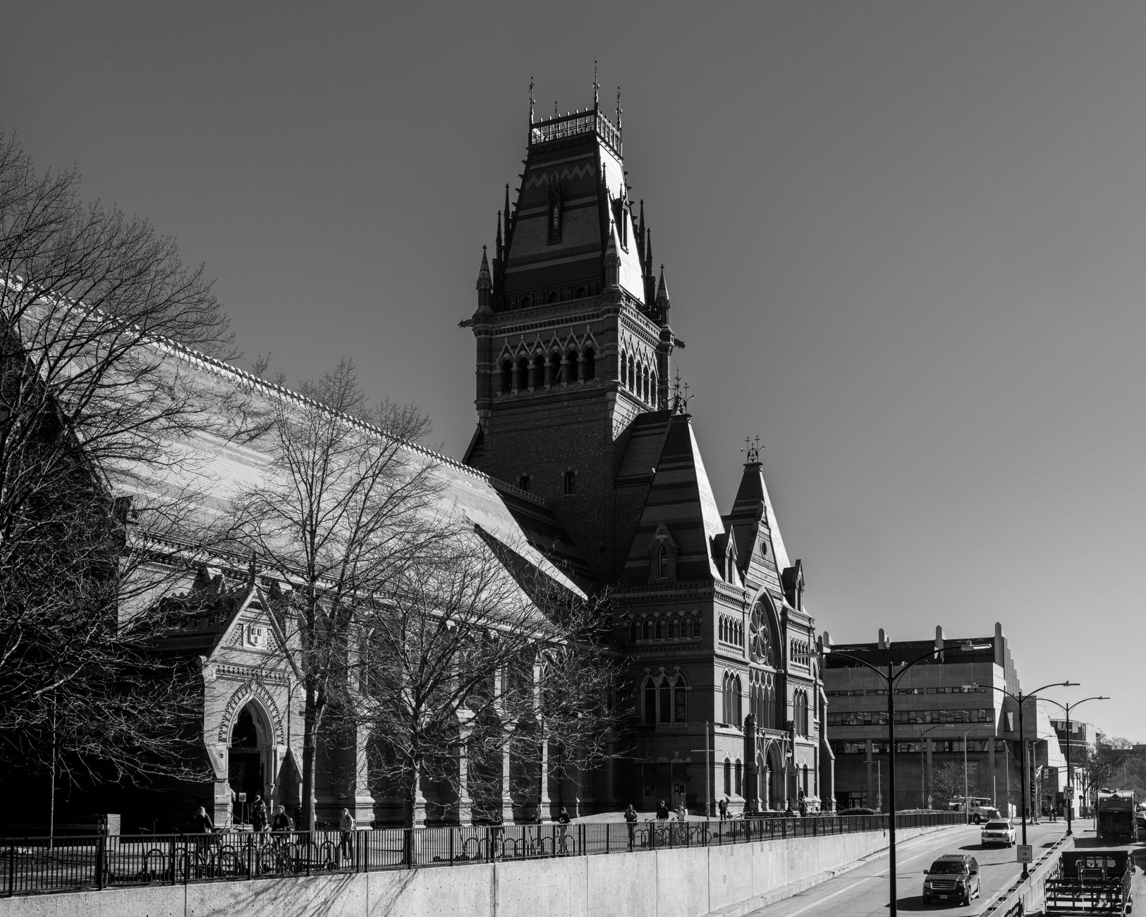 Black and white photograph of the historic Harvard Memorial Hall in Cambridge, Massachusetts, showcasing its Gothic architecture.