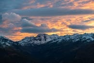 Stunning Sunset Over Snow-Capped Alpine Mountains