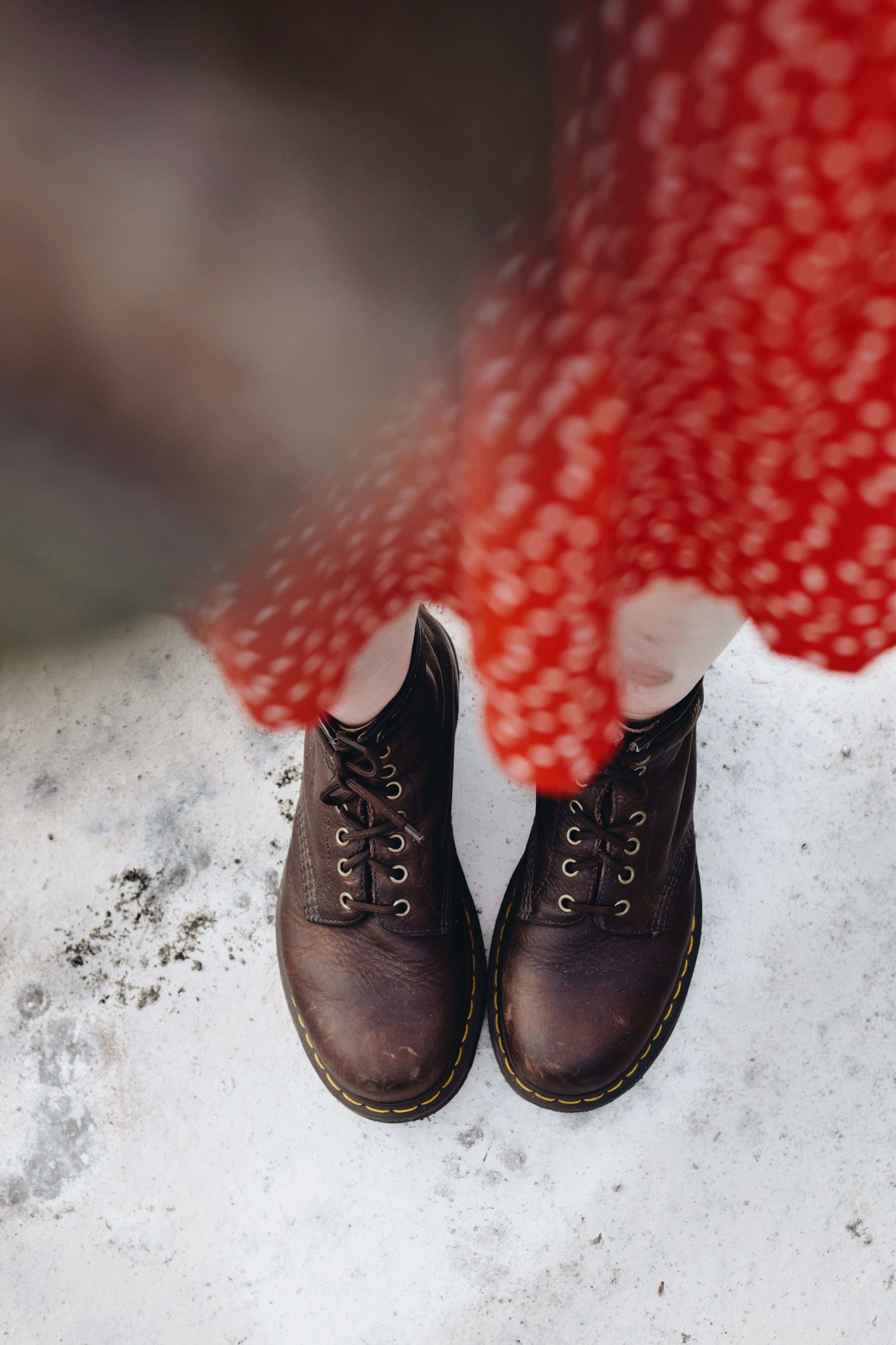Top view of brown leather boots and red dress · Free Stock Photo