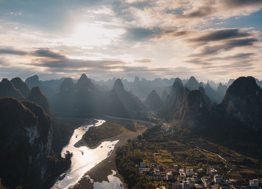 Stunning aerial view of the Li River and karst mountains in Guilin, Guangxi, China at sunset.